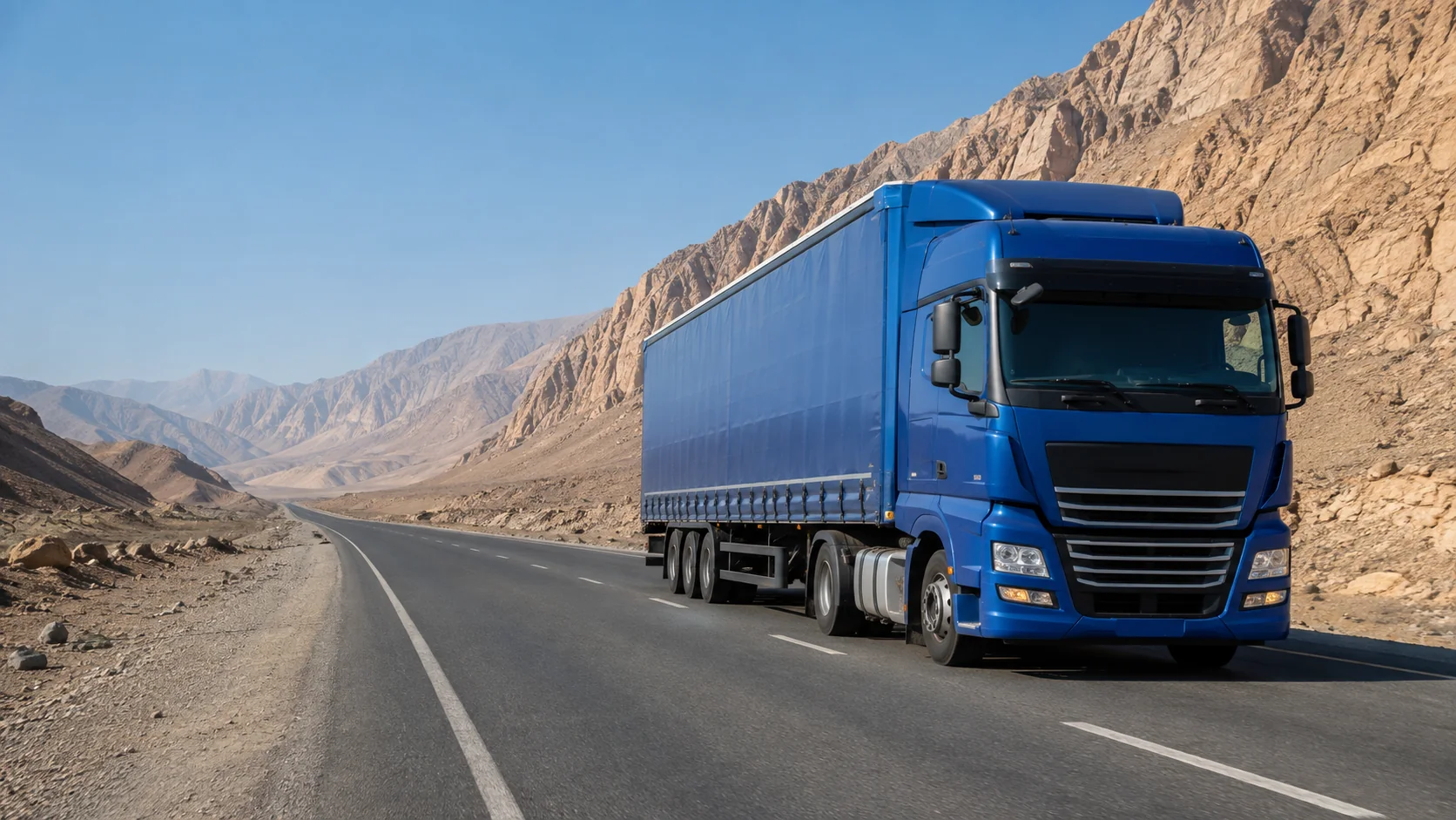 Blue TIR cargo truck on a Pakistan to Iran road freight corridor